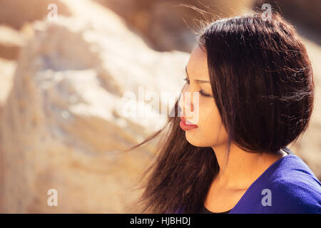 Beautiful young girl thinking in nature Stock Photo