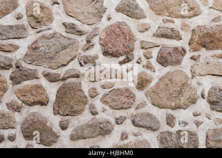 Old stone and brick medieval wall texture and background Stock Photo