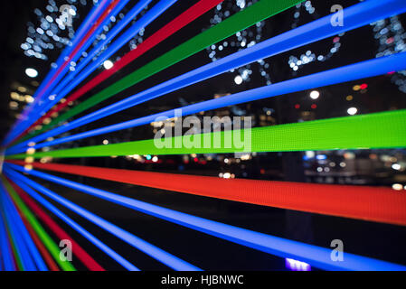 London, UK. 23rd Jan, 2017. Horizontal Interference at Winter Lights Canary Wharf, made by Joachim Slugocki and Katarzyna Malejka, two artists from Poland. It is composed by a modular site-specific installation links the tops of trees with streams of light. Credit: Alberto Pezzali/Pacific Press/Ģ����ý Live News Stock Photo