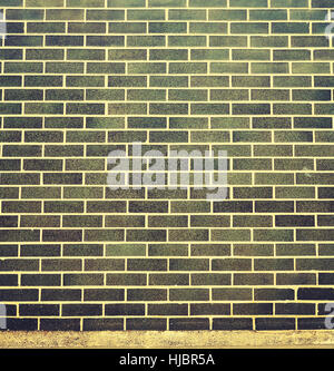 Color toned ceramic brick wall background. Stock Photo