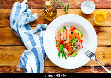 Vegetable spring salad on wooden table Stock Photo