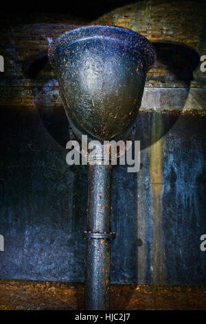 Either an overflow pipe or the entry funnel for the water in Finsbury Park Underground Reservoir, North London. Stock Photo