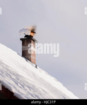 Chimney with fire coming out. Stock Photo