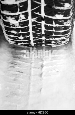 Car tire on a snow. Stock Photo
