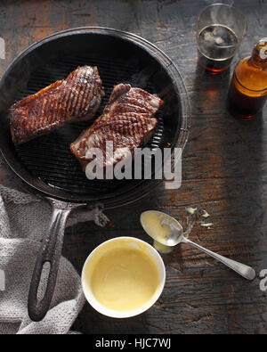 Sirloin steak in frying pan with bearnaise sauce Stock Photo