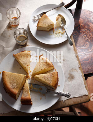 Bistro dessert of sliced New York cheesecake on table Stock Photo