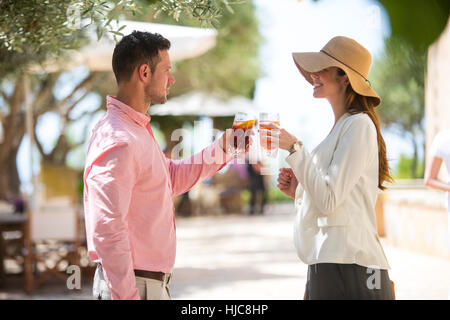 Couple making a toast on arrival to boutique hotel, Majorca, Spain Stock Photo