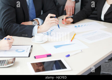 Working business people analyzing financial reports in office Stock Photo