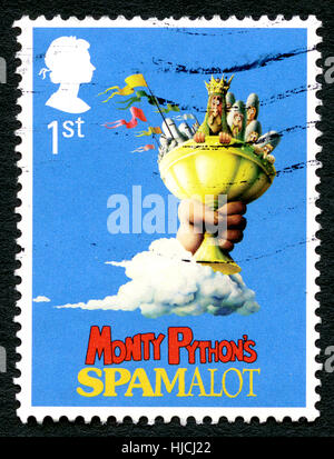 UNITED KINGDOM - CIRCA 2011: A used postage stamp from the UK, depicting an illustration promoting the Spamalot musical comedy adapted from the film M Stock Photo