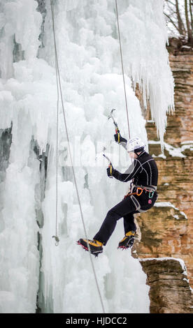 Nove Mesto Nad Metuji, Czech Republic. 24th Jan, 2017. A man climbs up an artificial ice wall in Nove Mesto nad Metuji, Czech Republic, on Tuesday, January 24, 2017. Central Europe has been hit by unusually freezing weather in recent days. Credit: David Tanecek/CTK Photo/Alamy Live News Stock Photo