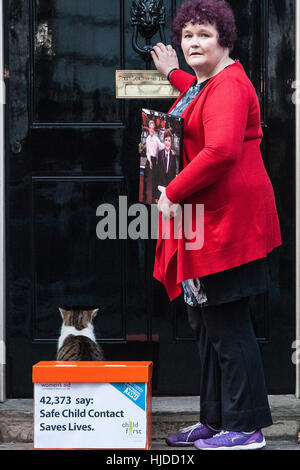 London, UK. 24th January, 2017. Claire Throssell, whose children were killed by her abusive ex-husband in 2014, presents a Child First petition signed by over 40,000 38 Degrees supporters at 10 Downing Street. Child First calls for an end to unsafe child contact with dangerous perpetrators of domestic violence through the family court process. Credit: Mark Kerrison/Alamy Live News Stock Photo