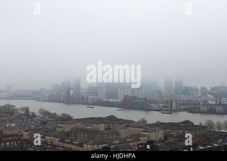 London, UK. 25th January, 2017. UK Weather: Heavy fog continues over London and Canary Wharf business park buildings © Guy Corbishley/Alamy Live News Stock Photo