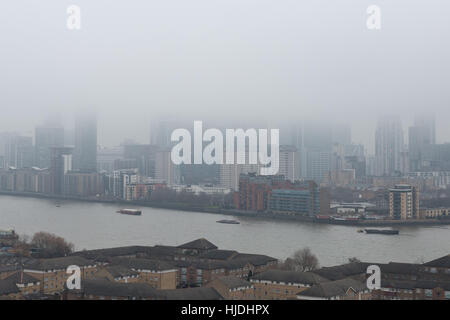 London, UK. 25th January, 2017. UK Weather: Heavy fog continues over London and Canary Wharf business park buildings © Guy Corbishley/Alamy Live News Stock Photo