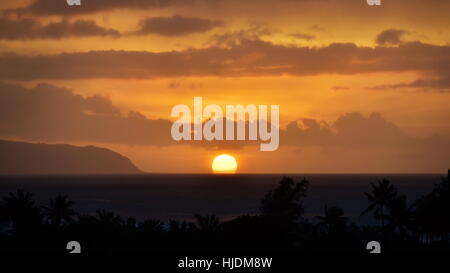 View of the Setting Sun over the Pacific Ocean on the Island of Hawaii Stock Photo