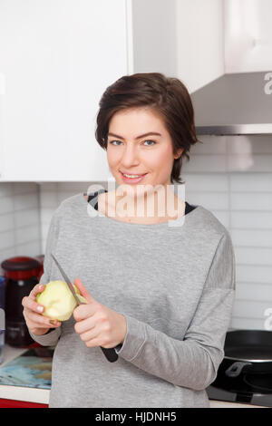Photo of girl with knife , apple