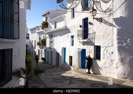 Local woman standing by her house in Frigiliana, Sp;ain Stock Photo