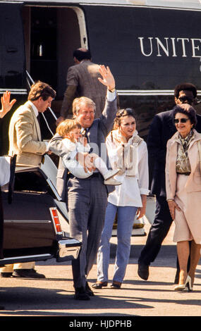 President Jimmy Carter disembarks Marine One holding grandson Jason Carter in his arm beginning an Easter weekend visit to Calhoun, Georgia in 1979. Grandson Jason Carter - now 39- was defeated in a run for governor in the 2014 Georgia general election. - To license this image, click on the shopping cart below - Stock Photo