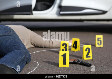 ID tents at crime scene after gunfight Stock Photo