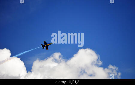 A blue angel jet flying out of a cloud over his home base in Pensacola Florida. Stock Photo