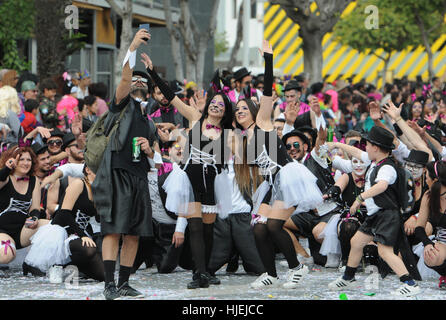 Happy people in teams dressed with colorful costumes at famous Limassol Carnival Parade on March 13 2016 , Cyprus. Stock Photo