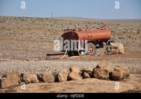 city, town, hill, desert, wasteland, male, masculine, car, automobile, vehicle, Stock Photo