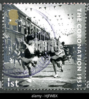UK - CIRCA 2003: A postage stamp from the UK, depicting a scene from the day of the Coronation of Queen Elizabeth II in 1953. Stock Photo