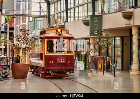 Vintage tramcars in Cathedral Junction, a combined shopping mall and tram stop in the centre of Christchurch, New Zealand. Stock Photo