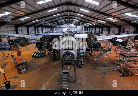 General view of the Avro Lancaster NX611 'Just Jane' as restoration works continue on the aircraft at Lincolnshire Aviation Heritage Centre at East Kirkby, Licolnshire. Stock Photo