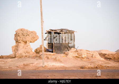 Tin, leather hide, wood, paper shack in the desert of the Danakil Depression, Afar, Tigray, Ethiopia Stock Photo