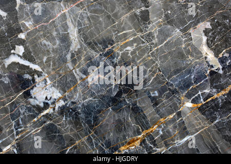 Patterned natural of  dark gray marble pattern (Gold Russia) for design. Stock Photo