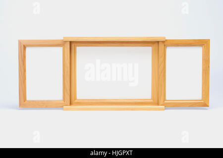 Three wooden picture frames on white background. Two size wooden picture frames. Stock Photo