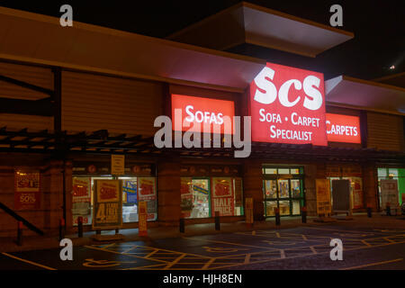 scs sofa carpets sign at night Great Western Retail Park Stock Photo