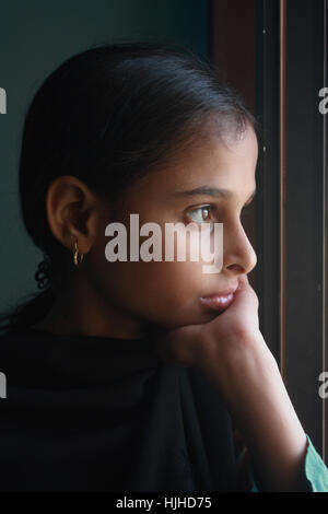 Teenage girl with window light Stock Photo