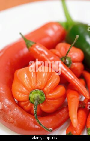 Heap of mixed fresh red hot chili peppers. Stock Photo