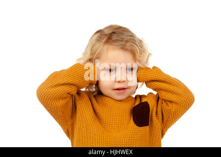 Little kid covering the ears isolated on a white background Stock Photo