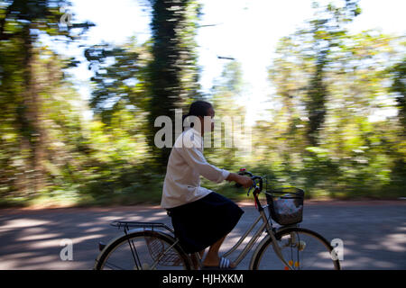 School Girl on Bike in Siem Reap - Cambodia Stock Photo