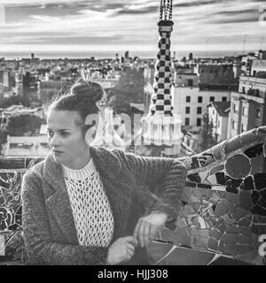 Barcelona signature style. elegant tourist woman in coat in Barcelona, Spain looking aside Stock Photo