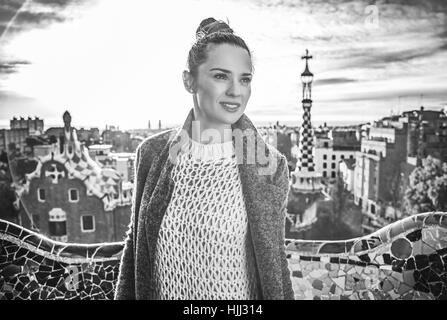 Barcelona signature style. young tourist woman in coat in Barcelona, Spain looking into the distance Stock Photo