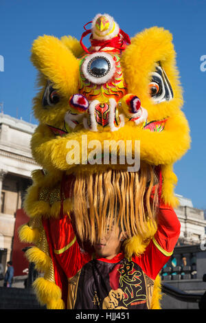 Lion Dancers from Chinatown perform on the steps of Trafalgar Square in front of the National Gallery ahead of this weekend's 'Year of the Rooster' Chinese New Year celebrations in London, UK. Stock Photo