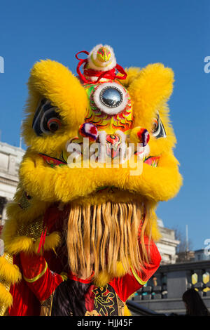 Lion Dancers from Chinatown perform on the steps of Trafalgar Square in front of the National Gallery ahead of this weekend's 'Year of the Rooster' Chinese New Year celebrations in London, UK. Stock Photo
