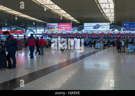 Passengers at check-in desk at Yinchuan Hedong International Airport, Ningxia province,,China Stock Photo