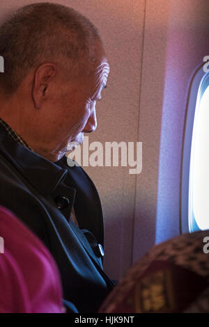 Chinese passenger on Air China flight Stock Photo