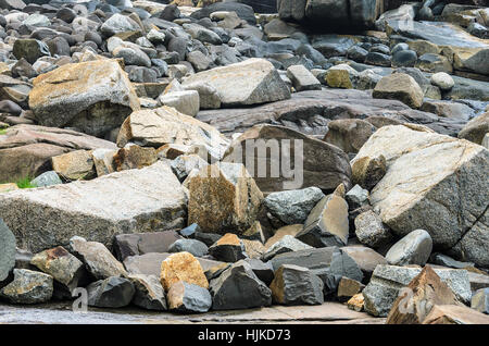 Many sea rocks, big rocks and small rocks. Sea rocks texture. Stock Photo