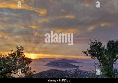 Sunset at Perdika village and Moni islet in the Aegina island located in the Saronic gulf, near Athens, Greece Stock Photo