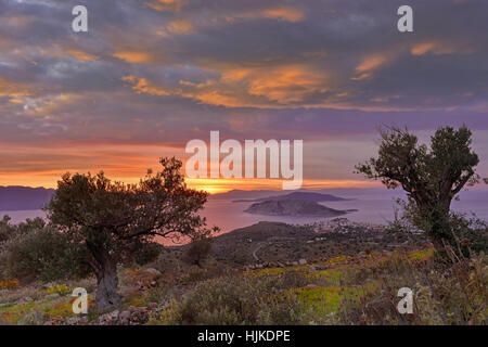 Sunset at Perdika village and Moni islet in the Aegina island located in the Saronic gulf, near Athens, Greece Stock Photo