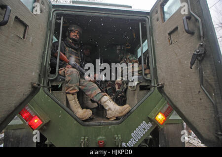 Srinagar, Kashmir. 24th Jan, 2017. Army soldiers arrive near the encounter site site at Hadoora area of central Kashmir's Ganderbal, Indian controlled Kashmir 24 January 2017, Two suspected militants were killed after encounter raged between government forces and suspected militants Credit: Umer Asif/Pacific Press/Alamy Live News Stock Photo