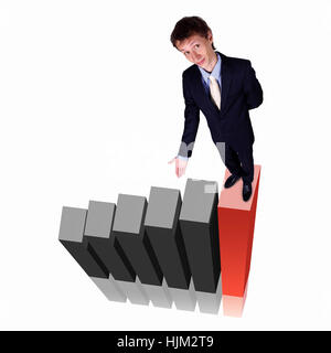 Image of a businessman standing on the top of financial charts Stock Photo