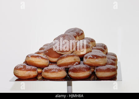 Heap of Fried Bavarian Cream Filled Donuts on Tray Stock Photo