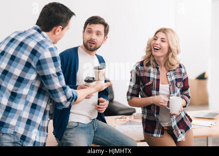 Nice friendly colleagues having a conversation Stock Photo