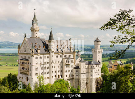 Neuschwanstein Castle is a nineteenth-century Romanesque Revival palace on a rugged hill near Fussen in southwest Bavaria, Germany. Stock Photo